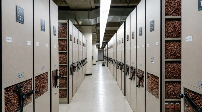 Industrial storage system holding roasted coffee beans in sealed containers to preserve freshness, consistency, and quality after roasting
