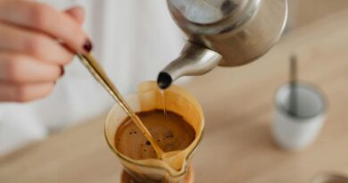 Hand brewing pour-over coffee with kettle, illustrating common coffee brewing mistakes that ruin flavor