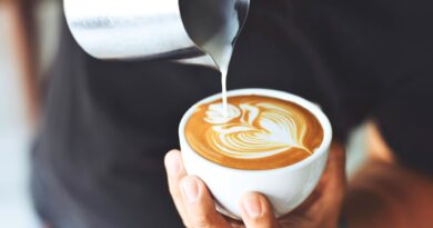 beginner latte art technique pouring milk into espresso