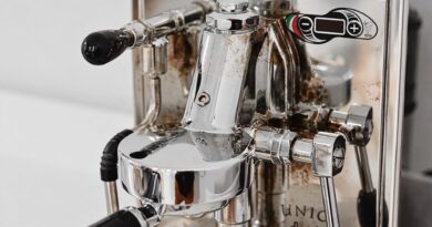 Close-up of coffee oil residue buildup on internal espresso machine components that require regular cleaning to prevent off-flavors