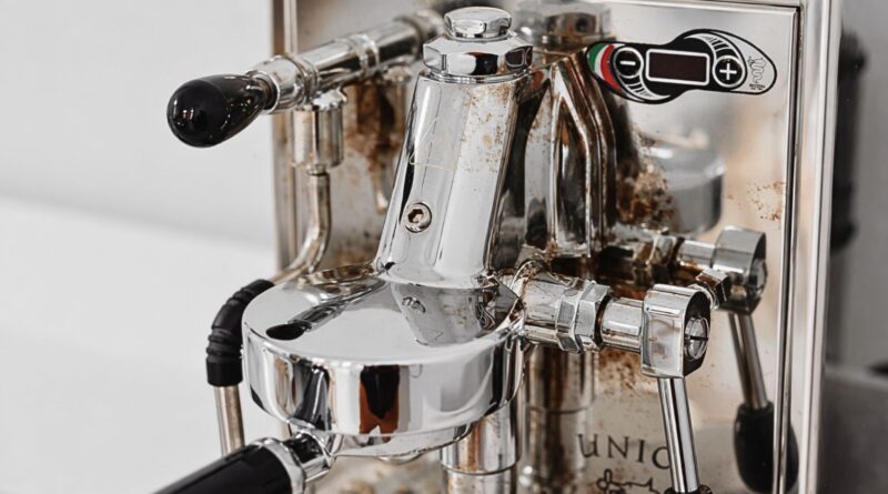 Close-up of coffee oil residue buildup on internal espresso machine components that require regular cleaning to prevent off-flavors