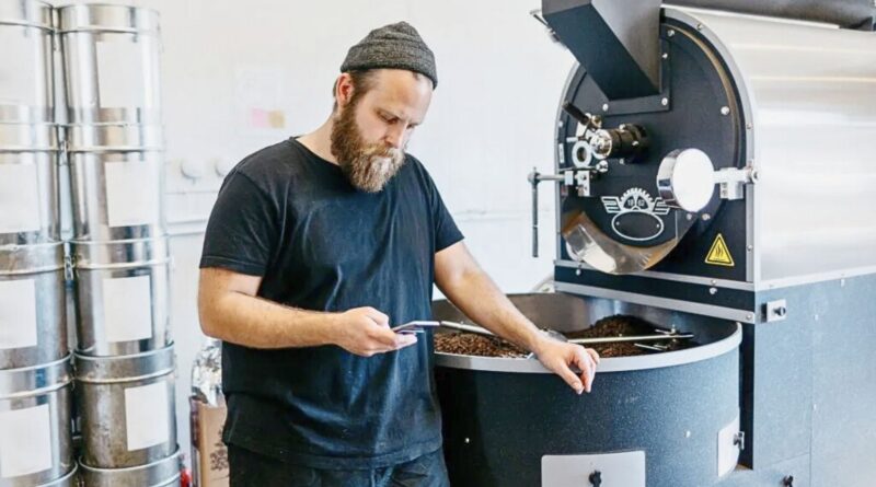 Coffee roaster analyzing roast progress to improve production efficiency without adding new equipment
