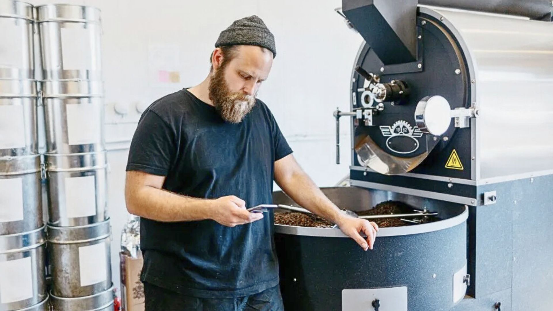 Coffee roaster analyzing roast progress to improve production efficiency without adding new equipment