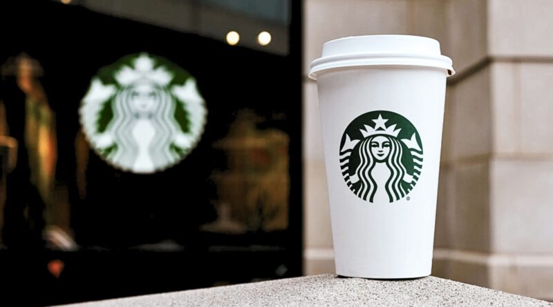 Starbucks takeaway coffee cup illustrating the power of menu naming and brand perception in modern cafés