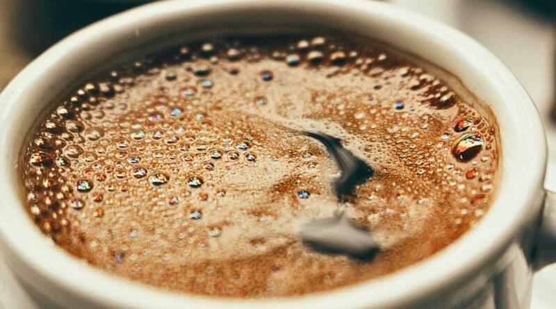 Close-up of brewed coffee highlighting caffeine’s role in daily consumption