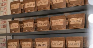 Specialty coffee bags displayed on shelves, representing consistency and repeat purchase decisions in roasteries