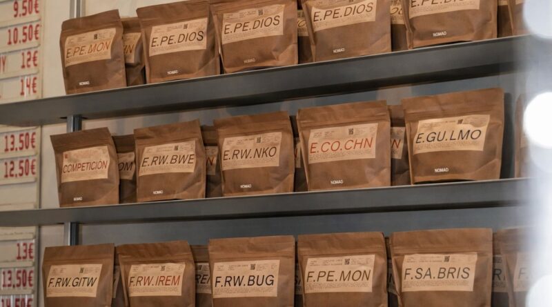 Specialty coffee bags displayed on shelves, representing consistency and repeat purchase decisions in roasteries