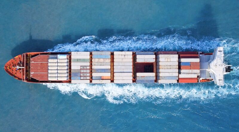 Container ship transporting goods across the ocean, illustrating how value and risk move through the global coffee trade