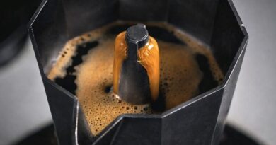 Coffee extracting smoothly from a moka pot with controlled heat to reduce bitterness and improve flavor balance