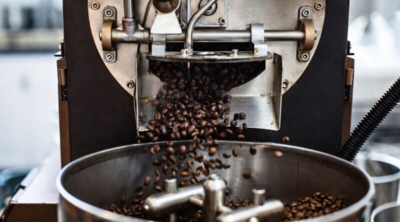 Coffee beans cooling after roasting inside a drum roaster, showing controlled roasting process for beginner and professional roasters