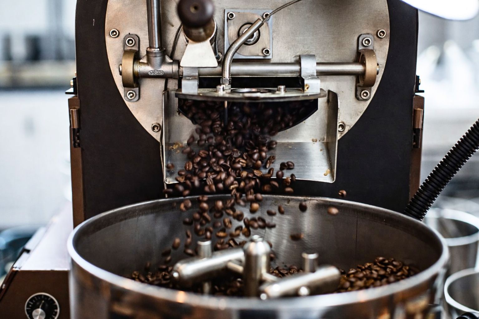 Coffee beans cooling after roasting inside a drum roaster, showing controlled roasting process for beginner and professional roasters