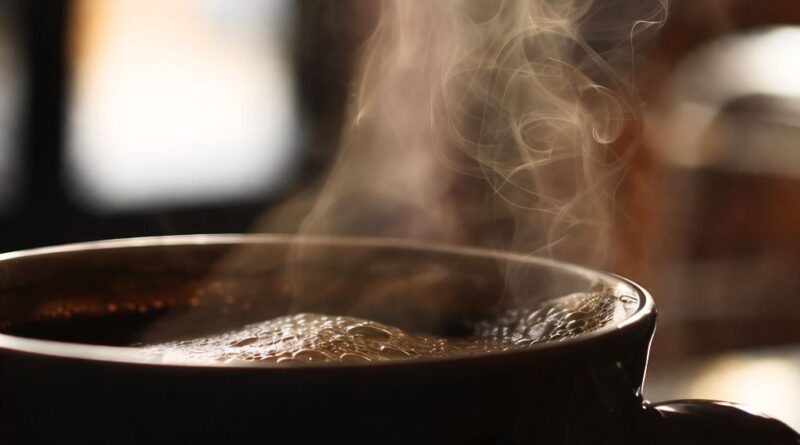 Steaming cup of hot coffee illustrating how coffee consumption stimulates digestion and bowel movements through gut and nervous system activation
