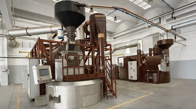 Large-scale coffee roasting facility illustrating the operational and cost pressures roasteries face when balancing budget discipline with coffee quality