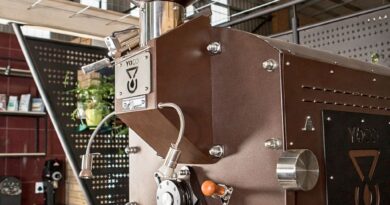Commercial coffee roasting machine inside a professional roastery, illustrating production scale, workflow, and equipment considerations in 2026