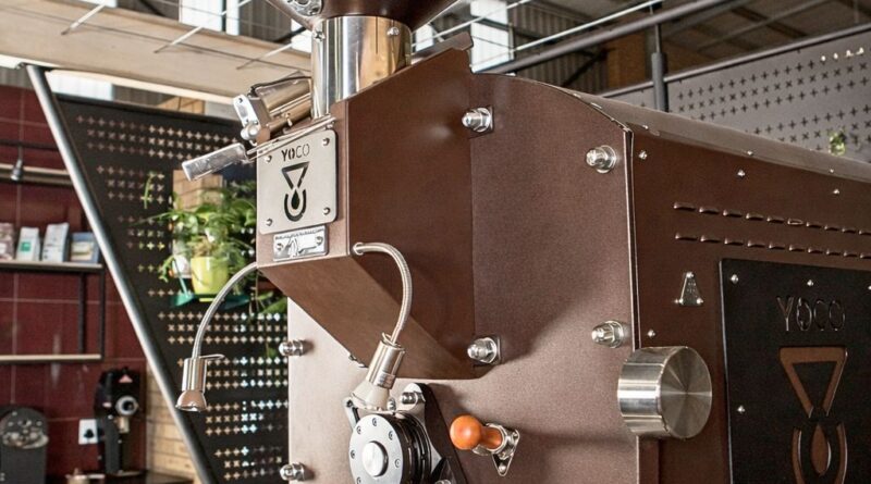 Commercial coffee roasting machine inside a professional roastery, illustrating production scale, workflow, and equipment considerations in 2026