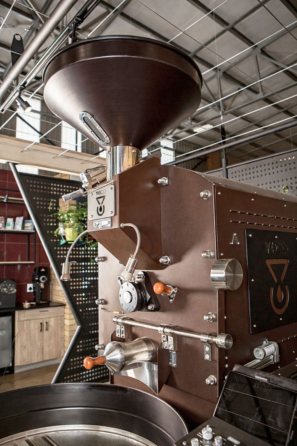 Commercial coffee roasting machine inside a professional roastery, illustrating production scale, workflow, and equipment considerations in 2026