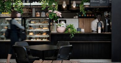 Busy café counter during peak hours showing how marketing-driven demand can strain operations and service consistency